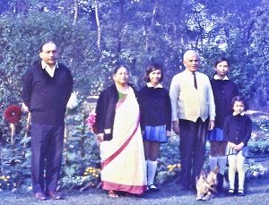 The writer’s father, Ajit Kumar Kahali, her grandparents, her two sisters with dog Greaty, and herself (on the far right), at their house in Jamshedpur.
