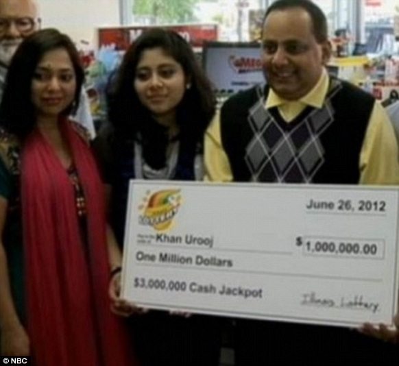 "urooj khan and his family with the one million dollar cheque"