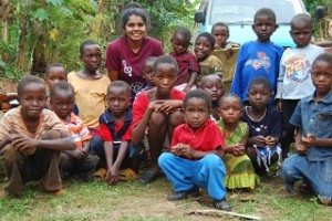 Indian American teenager Sri Muppidi with children during a recent trip to Africa.