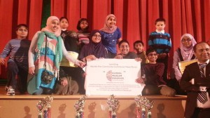 Tausif Malik (far right) with the winners of the 2013 Muslim Spelling Bee.