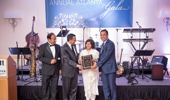 Faizal and Shabana Kottikollon accepting the award at the inaugural AIF gala in Atlanta on March 25, 2015.Photo credit: Venkat Kuttua Photography