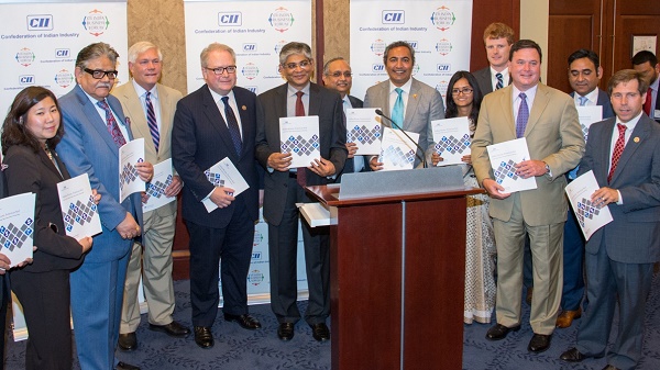 Members of Congress, Indian Ambassador to the United States Arun Singh and CII officials pose for a photo after releasing the report “Indian Roots American Soil” on Capitol Hill on July 14, 2015. From left to right: Rep. Grace Meng, CII President Sumit Mazumder, Rep. Pete Sessions, Rep. George Holding, Ambassador Singh, CII Director General Chandrajit Banerjee, Rep. Ami Bera, CII Director & Head North America Sumani Dash, Rep. Joe Kennedy, Rep. Todd Rokita, CII-IBF Chairman Vivek Sharma and Rep. Chuck Fleischmann. Photo credit: CII