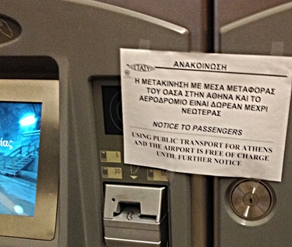 Sign at a metro station: "Using public transport for Athens is free of charge until further notice."