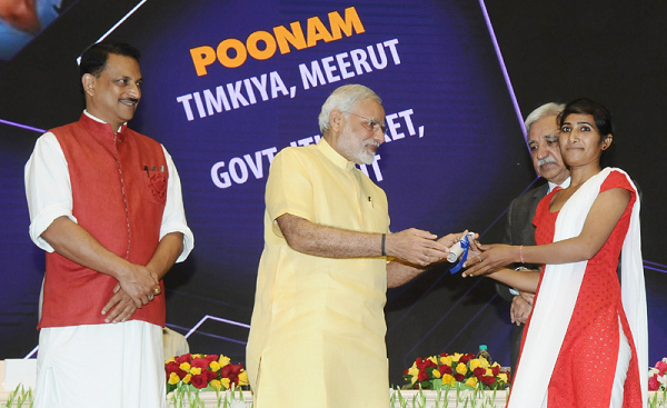 Prime Minister Narendra Modi handing over the job letter to an ITI trainee at the launch of the Skill India Mission in New Delhi on July 15, 2015. Photo credit: PIB