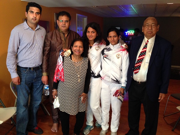 Richa Mishra (third from right), winner of six gold medals at the 2015 World Police & Fire Games, with Indian American community leaders Sunil Singh (second right) and Sambhu Banik.