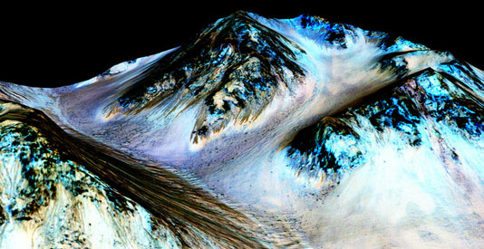 Researchers say dark, narrow, downhill streaks could be evidence of water on Mars. (Courtesy of Jet Propulsion Laboratory/University of Arizona, via NASA)