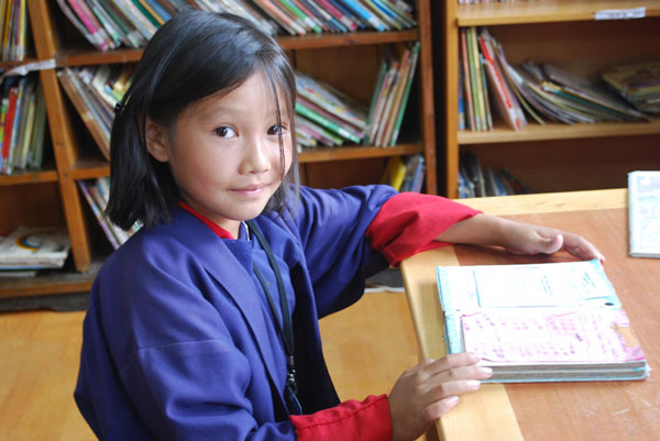 Bhutan-girl-in-READ-Library-credit-READ-Global
