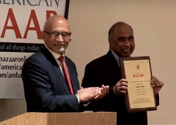 Frank Islam with the American Bazaar Philanthropy Award, which was presented to him by Assistant Secretary of Commerce Arun Kumar, in Washington, DC, on October 10, 2015.