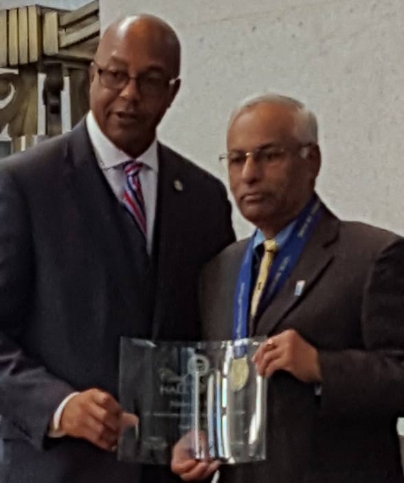 Nirmal Sinha (right) being inducted to the Ohio Civil Rights Hall of Fame by its chairman Leonard Hubert.
