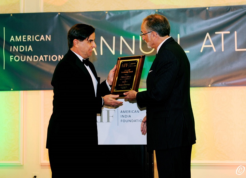 Eduardo Martinez, CEO of UPS Foundation, receiving AIF honor from Ambassador Charles Shapiro on behalf of David Abney at the AIF gala on April 2, 2016. Photo credit: ByteGraph