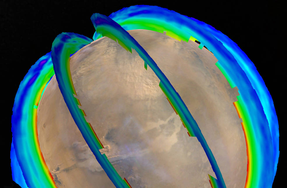 This graphic presents Martian atmospheric temperature data as curtains over an image of Mars taken during a regional dust storm. The temperature profiles extend from the surface to about 50 miles up. Temperatures are color coded, from minus 243 degrees Fahrenheit (purple) to minus 9 F (red).(Image Courtesy: NASA)