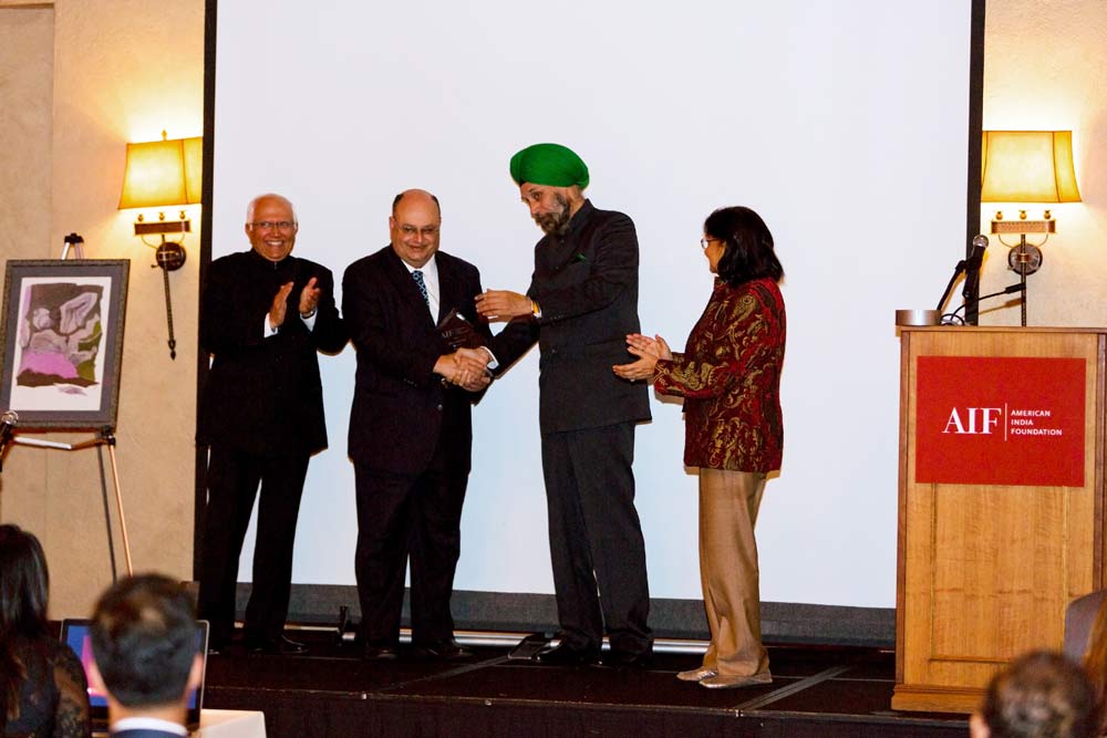 Indian Ambassador to the United States Navtej Sarna (second right) congratulates honoree Pradman Kaul (second left). Also seen are AIF Board Vice Chair Pradeep Kashyap (left) and Gala Chair Mahinder Tak.