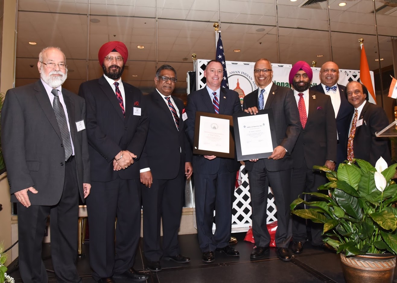 Steve McAdams, Executive Director of Maryland Governor's Office of Community Initiatives (fourth from left), being recognized for distinguished public service and outstanding contributions to the community. 