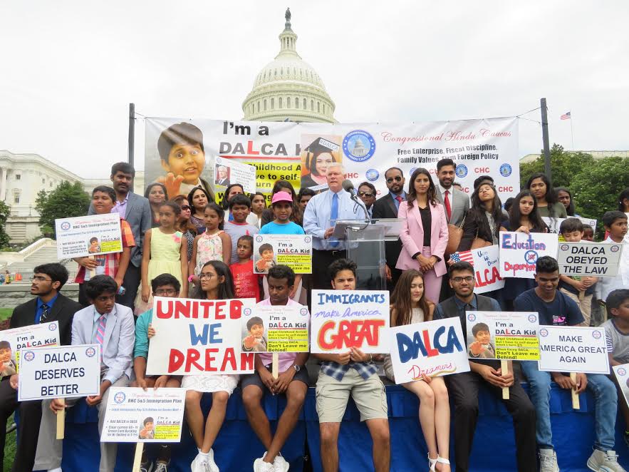 Republican Congressman Pete Sessions of Texas (at the podium) is flanked by DALCA kids, children of legal immigrants from India, at an immigration rally organized by the Republican Hindu Coalition (RHC) on Capitol Hill. Standing at right are Manasvi and Vikram Aditya Kumar of RHC who spearheaded the event urging US lawmakers to protect the legal Dreamers from deportation when they age out at 21