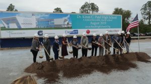 Dr. Kiran Patel (sixth from left) and Dr. Pallavi Patel (fifth from left) at the groundbreaking ceremony of the $20 million Kiran C. Patel High School in Temple Terrace, FL, on December 13, 2018.