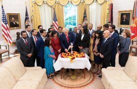 President Donald Trump lighting the Diwali 'diya' in the Oval Office, surrounded primarily by Indian-Americans serving in his administration. It is the third consecutive year that the president has celebrated the popular Indian festival of lights in the White House.