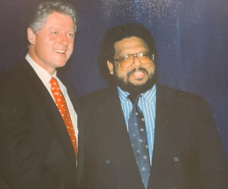 Aziz Haniffa with President Bill Clinton.