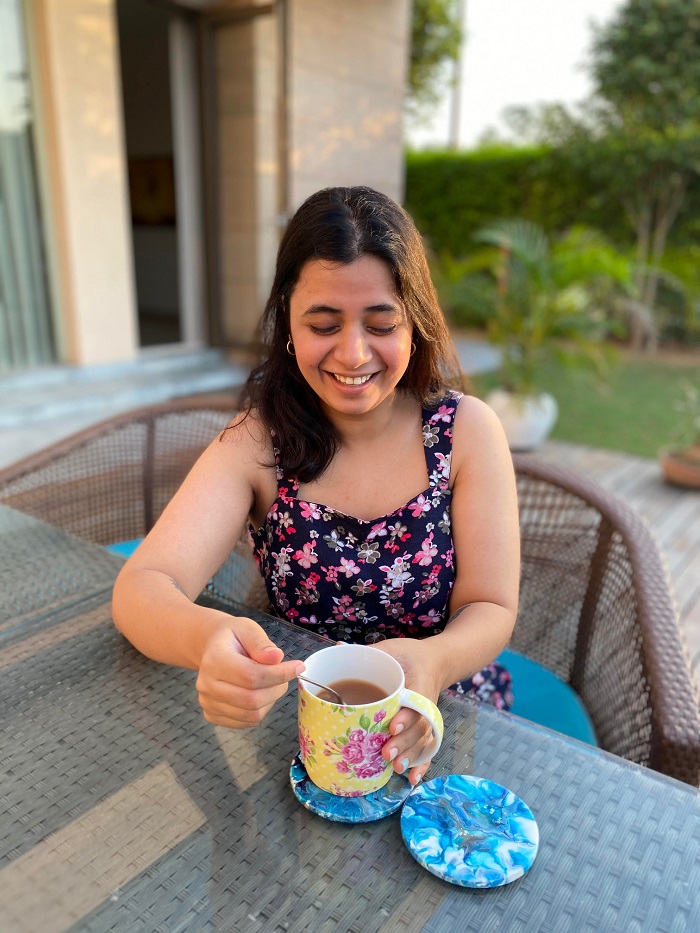Writer Akanksha Dean enjoying her cuppa in her villa at Karma Lakelands 