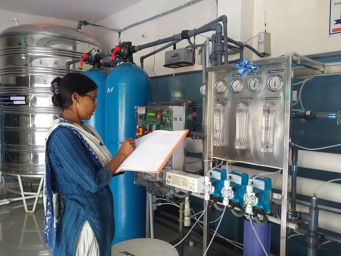 A Water Aunty working in an â€œiJalâ€ station. Safe Water Network has transformed the lives of women by empowering them to become Water-entrepreneurs. 