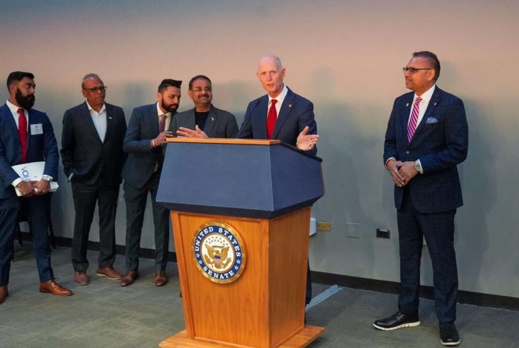 Sen. Rick Scott (R-FL) addressing delegates of the Asian American Hotel Owners’ Association at a congressional reception hosted by the organization in Washington, DC, on March 7, 2023. From left to right: Florida Region Ambassador Kunal Gaekwad, member Jayesh Patel, Treasurer Meeraj Patel, Danny Gaekwad and Vice Chairman Bharat Patel.